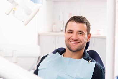 man smiling after getting his wisdom teeth removed at North Atlanta Family Dentistry in Cumming, GA