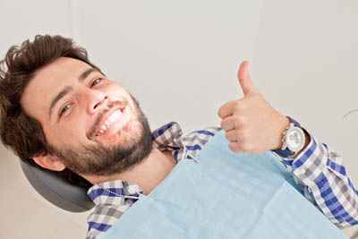 man smiling during his dental appointment at North Atlanta Family Dentistry in Cumming, GA