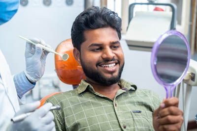 man smiling after receiving dental care at North Atlanta Family Dentistry