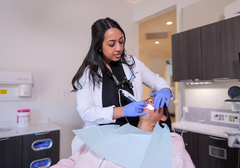 North Atlanta Family Dentistry clinician checking patient's teeth